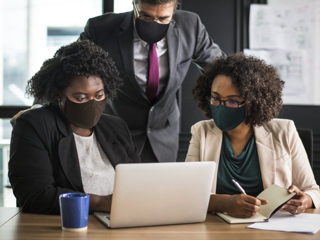 Business new normal, people wearing masks in the office Business new normal, people wearing masks in the office